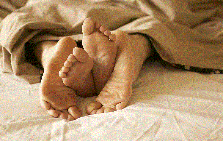 Feet In Bed